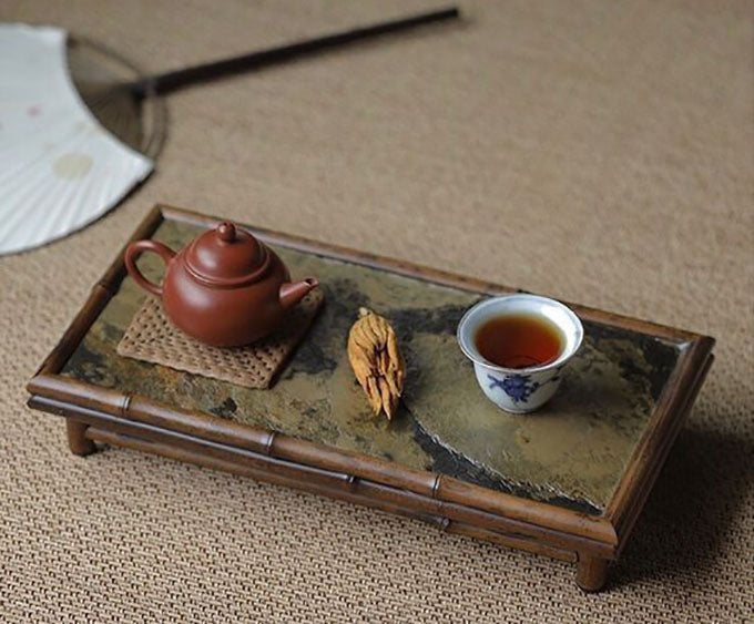 The choice of teaware contributes to the overall experience, influencing the taste and aroma of the brewed tea.