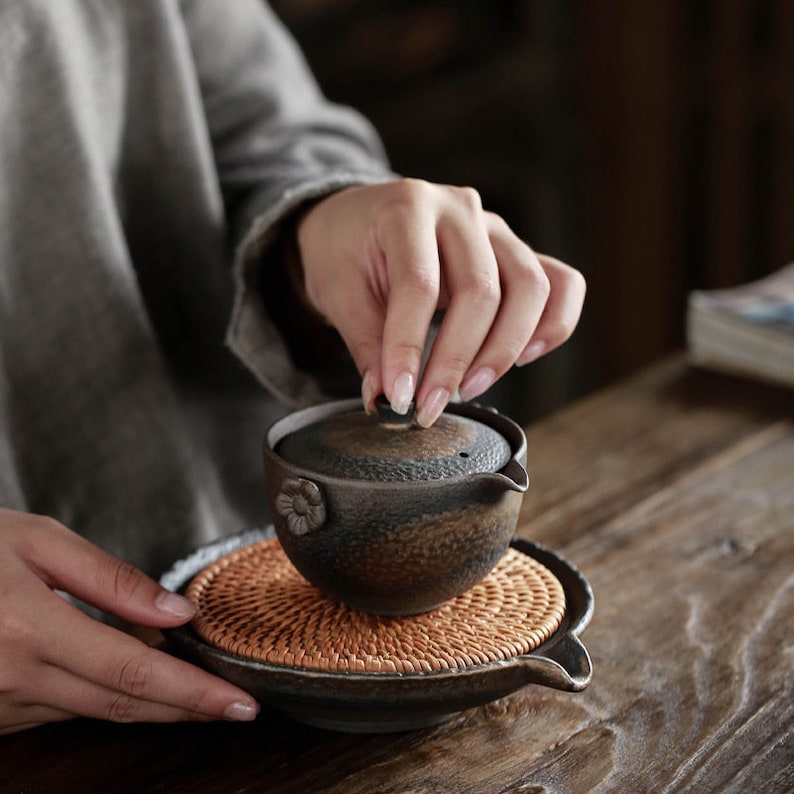 Japanese Woven Rattan and Rustic Ceramic Teapot Holder