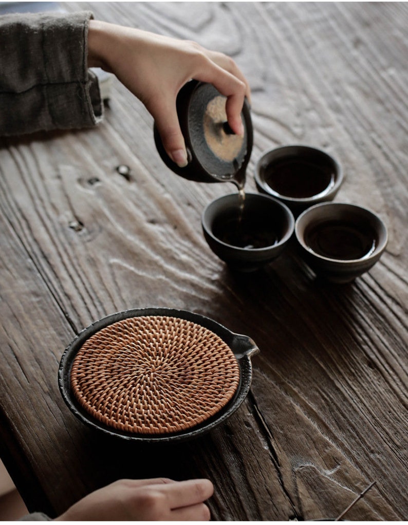 Japanese Woven Rattan and Rustic Ceramic Teapot Holder