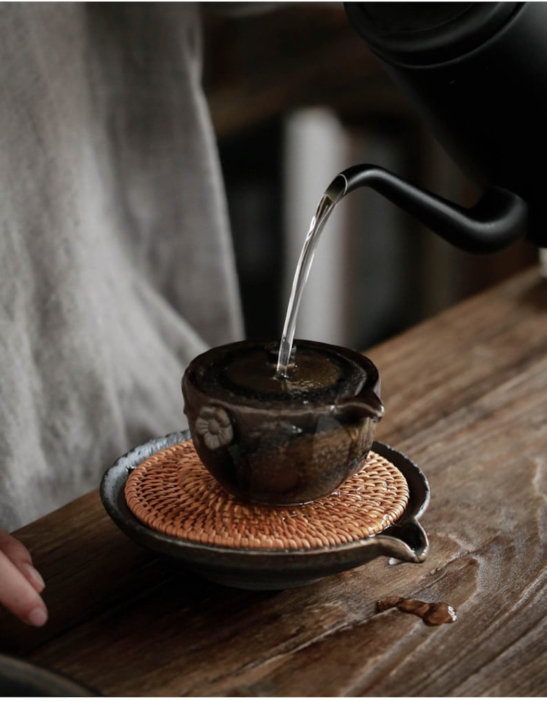 Japanese Woven Rattan and Rustic Ceramic Teapot Holder